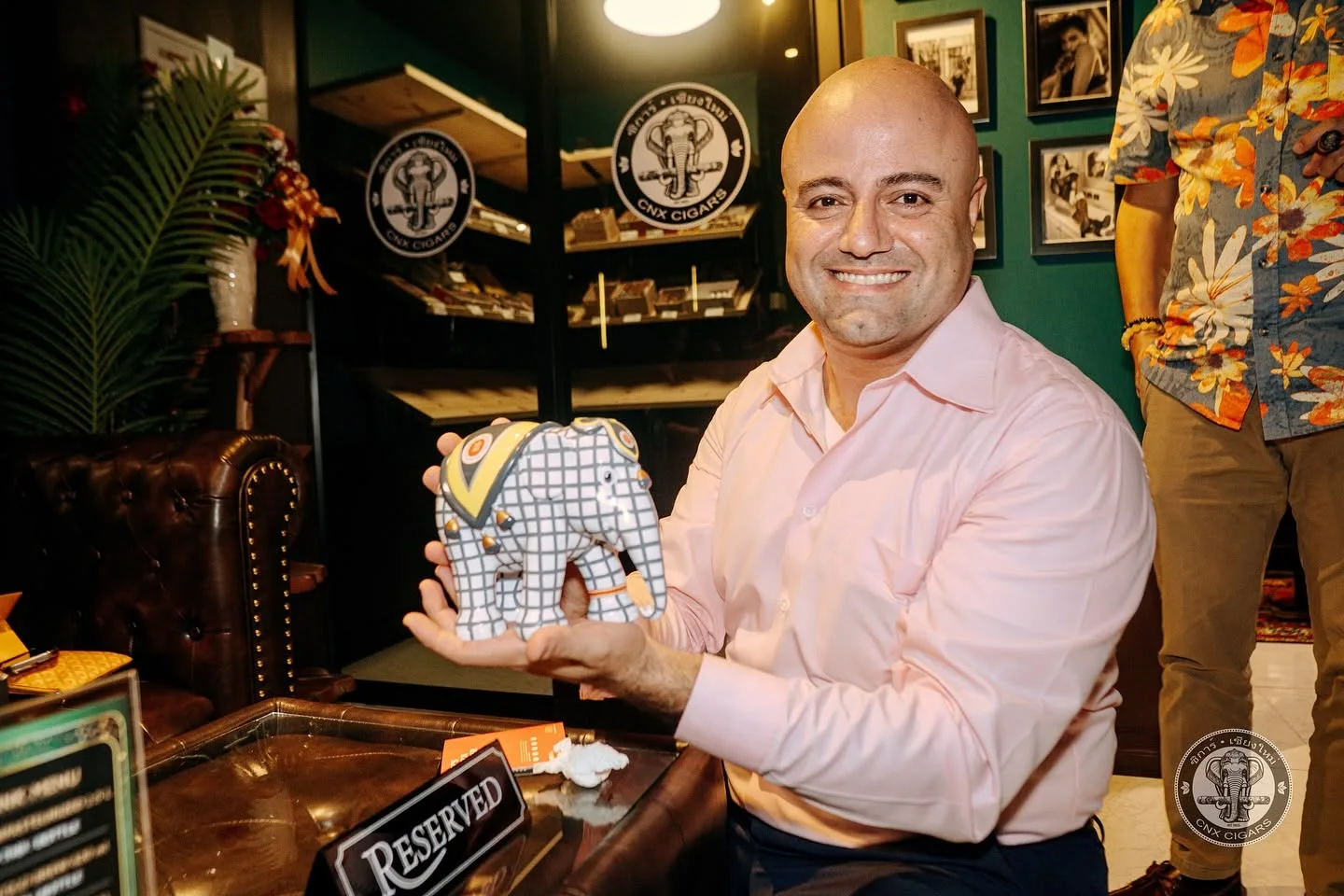 CNX Cigars owner holding a premium cigar box